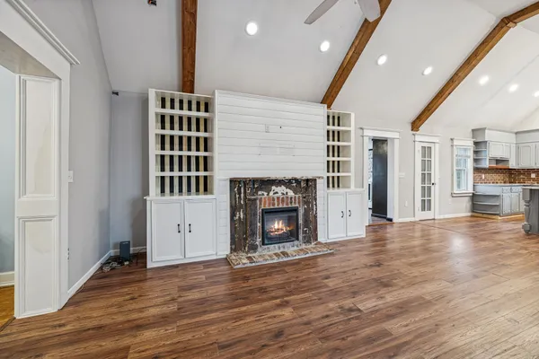 a kitchen with stainless steel appliances granite countertop a stove and cabinets