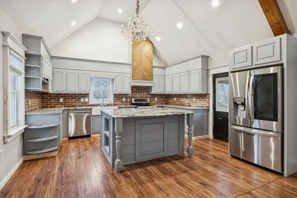 a kitchen with a sink and a stove
