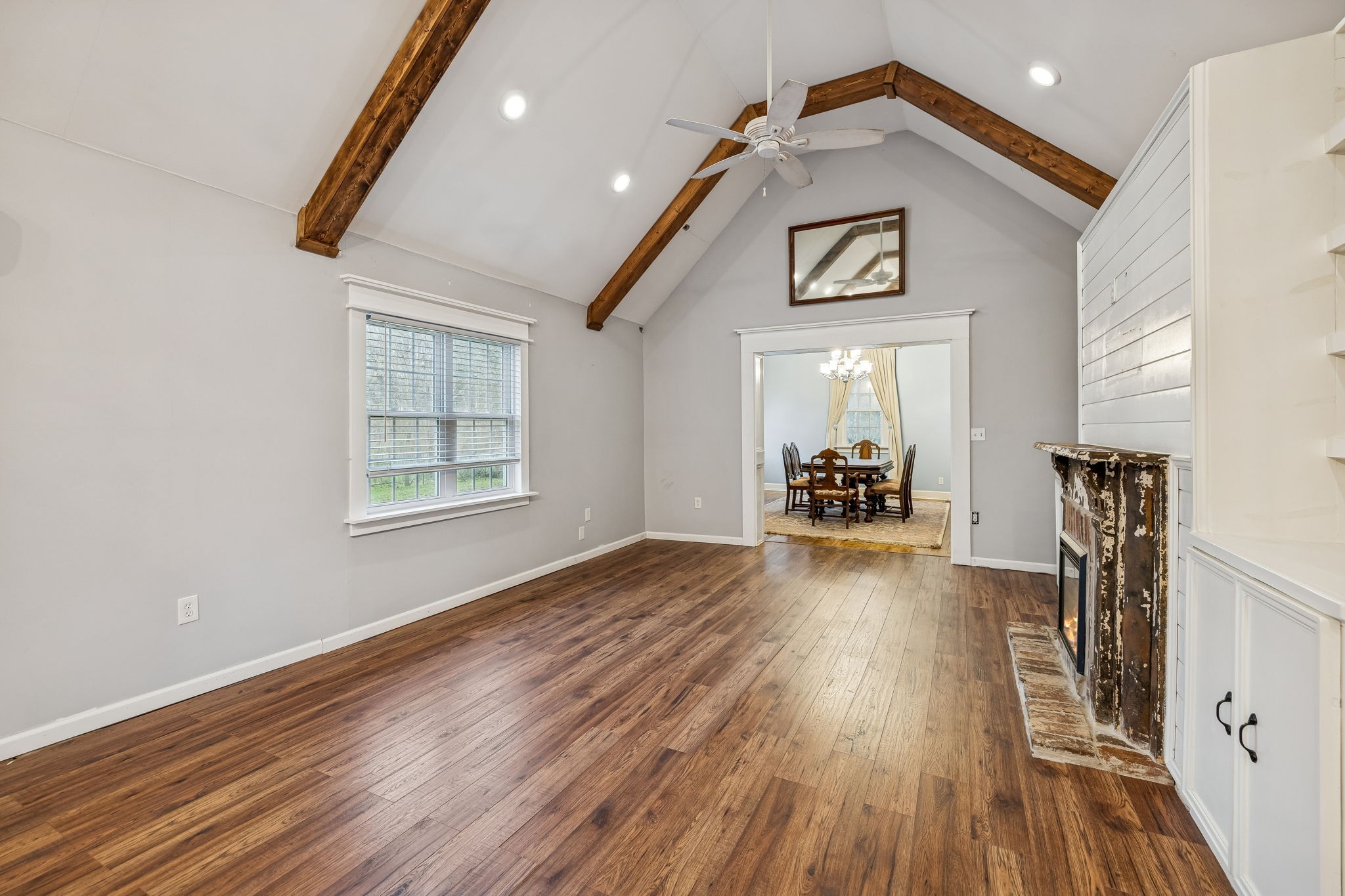 5360 Bunker Hill Road Pulaski, TN 38478 - Photo 21 of 69 a view of a livingroom with wooden floor and a ceiling fan