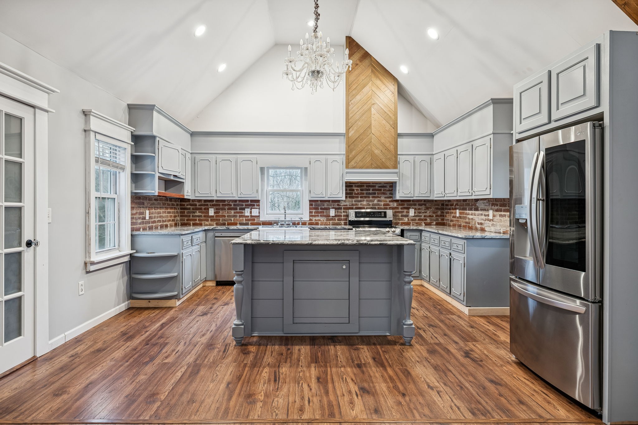 5360 Bunker Hill Road Pulaski, TN 38478 - Photo 25 of 69 a kitchen with granite countertop a refrigerator oven a sink dishwasher and white cabinets with wooden floor