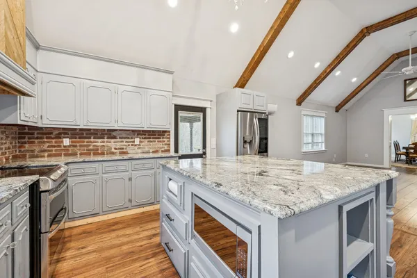 a bathroom with a toilet a sink and shower