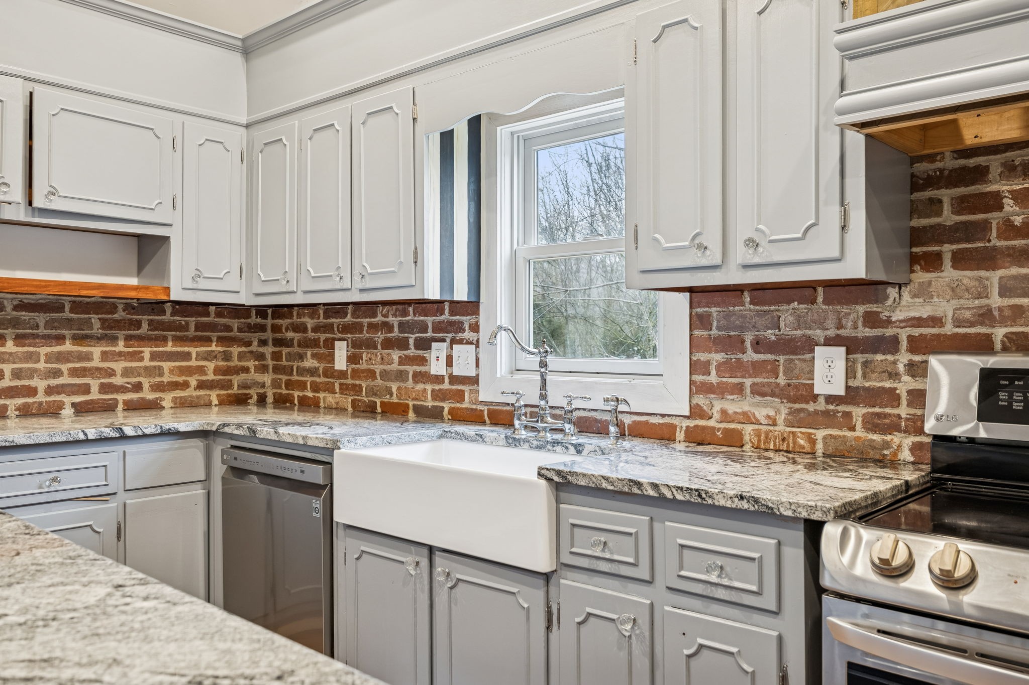 5360 Bunker Hill Road Pulaski, TN 38478 - Photo 29 of 69 a kitchen with stainless steel appliances granite countertop a sink stove and cabinets