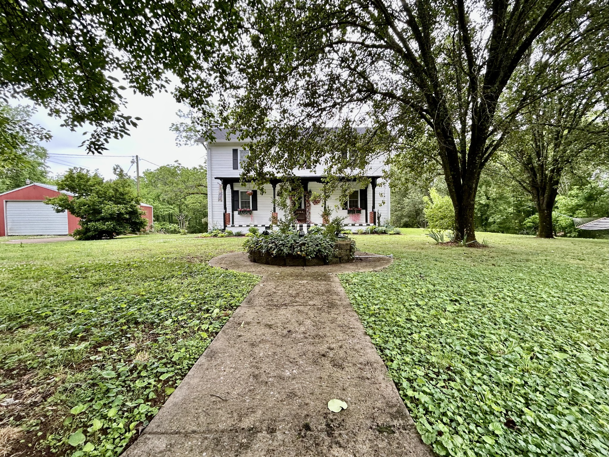5360 Bunker Hill Road Pulaski, TN 38478 - Photo 3 of 69 a front view of a house with garden