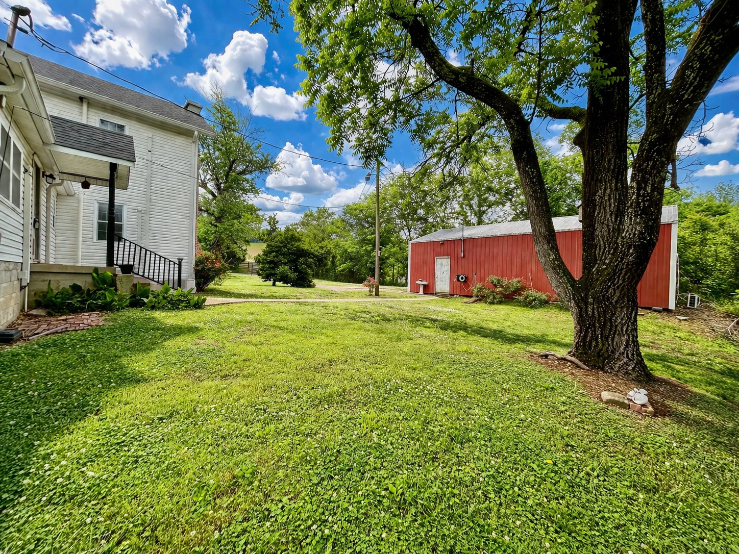 5360 Bunker Hill Road Pulaski, TN 38478 - Photo 9 of 69 a view of an house with backyard space and a tree