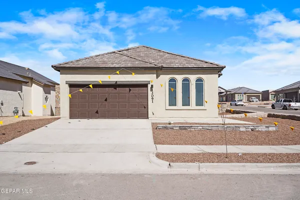 a front view of a house with a garage