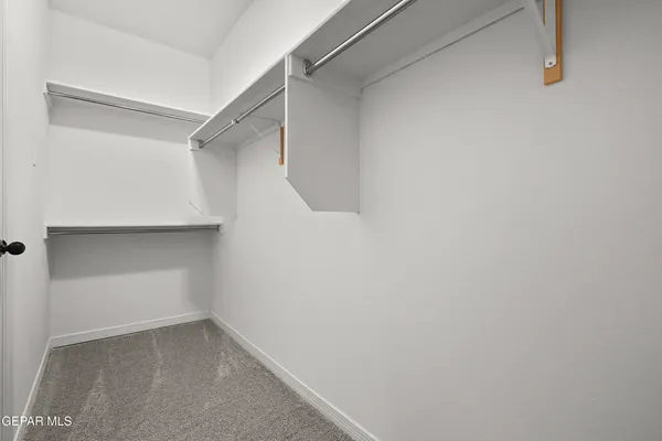 a view of an empty walk in closet