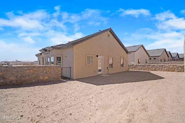 a view of a house with a snow in the background
