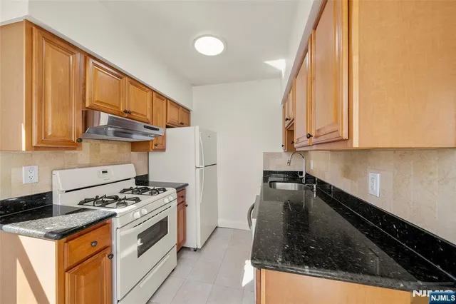 a kitchen with a stove and a microwave