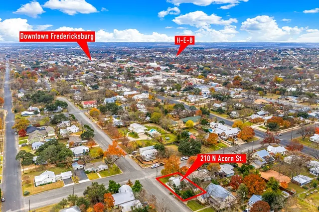 a street sign that is sitting on a field