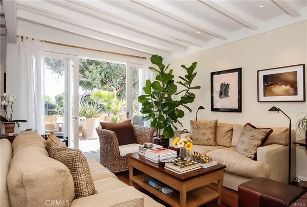 a living room with furniture and a book shelf