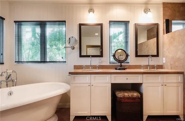 a room with a large window and furniture