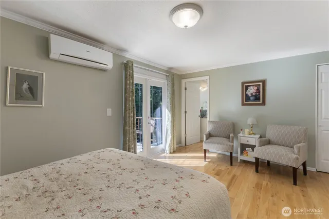 a bedroom with a bed and a couch