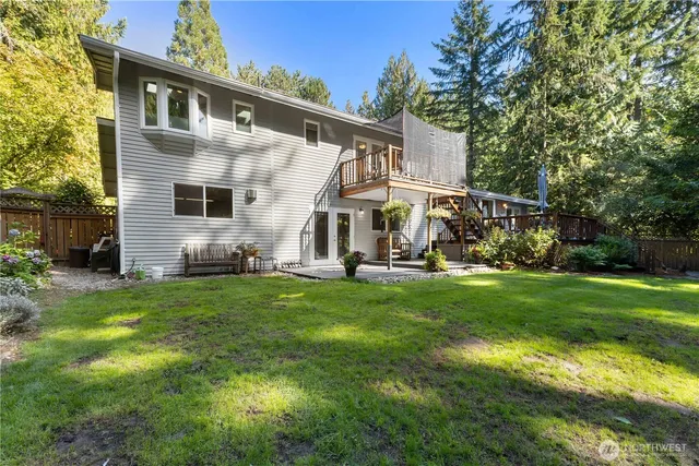 a view of a back yard of the house with green space