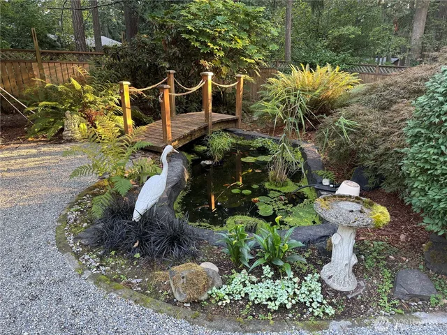a view of a fire pit with flower plants