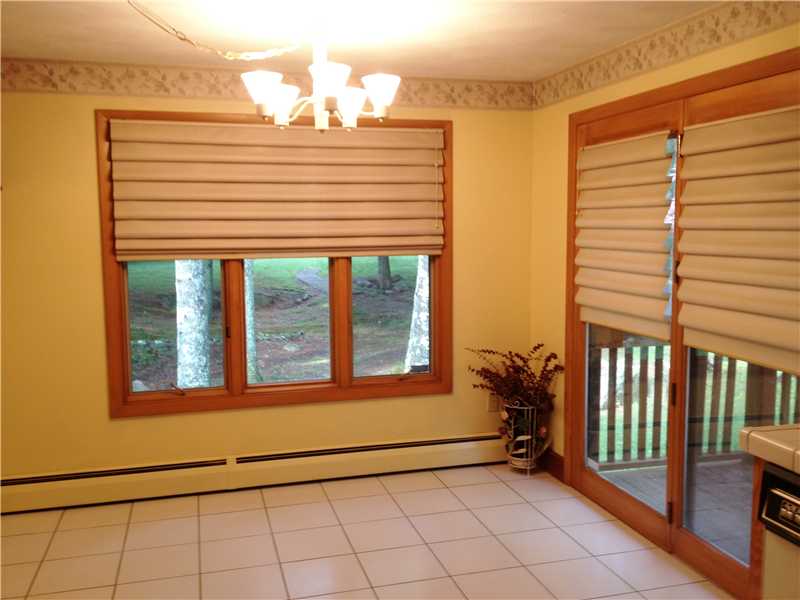 809 Hope Furnace Road Scituate, RI 02831 - Photo 6 of 20 Kitchen. Eat-in-kitchen area. French door leads out to deck to side of home.