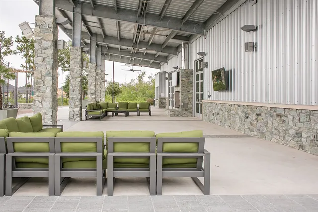 a view of a house with a swimming pool and a yard