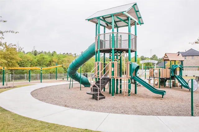 a view of a house with swimming pool and sitting area