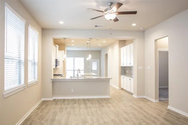 a view of a kitchen and a window