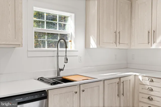 a kitchen with a sink and cabinets