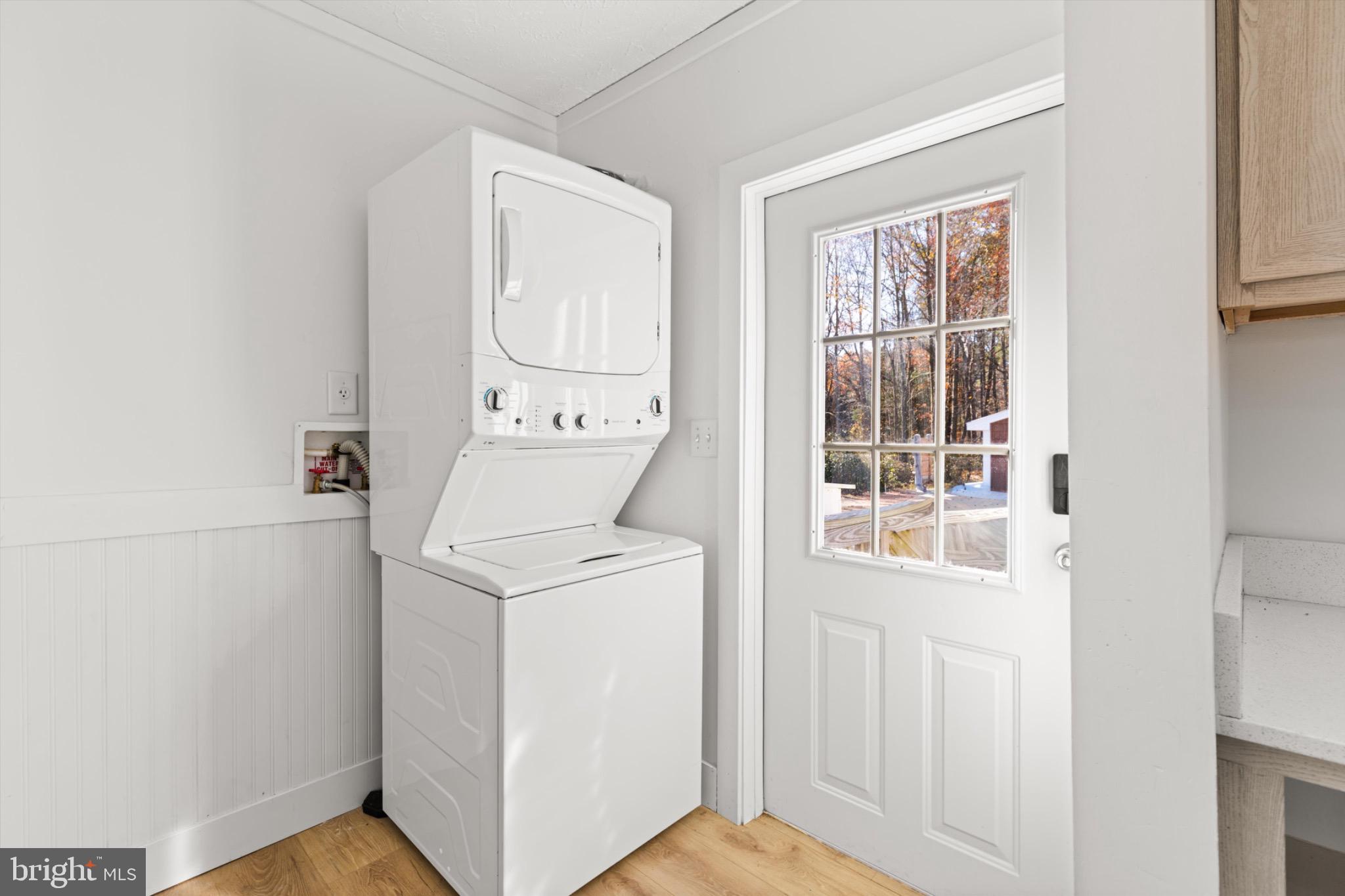 8937 Ninepin Branch Road Berlin, MD 21811 - Photo 13 of 44 Bright laundry nook with outdoor access.