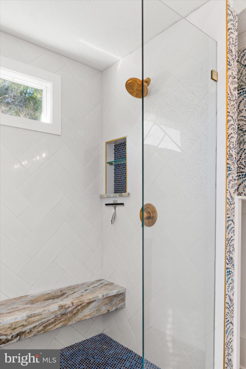 8937 Ninepin Branch Road Berlin, MD 21811 - Photo 25 of 44 Sleek shower with elegant stone accents.