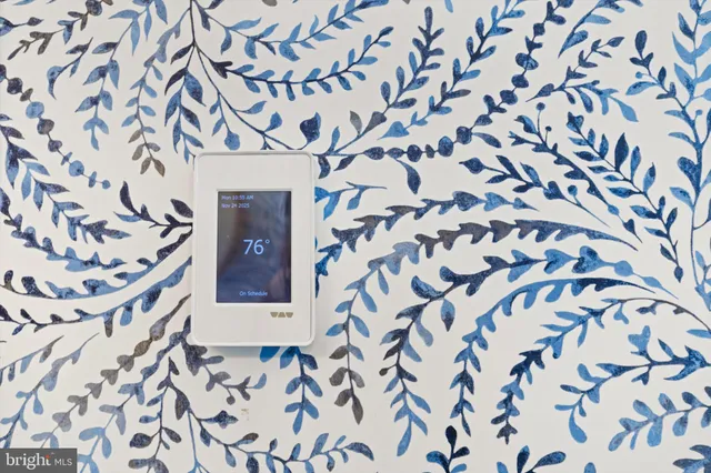 a view of a house with backyard and a tree