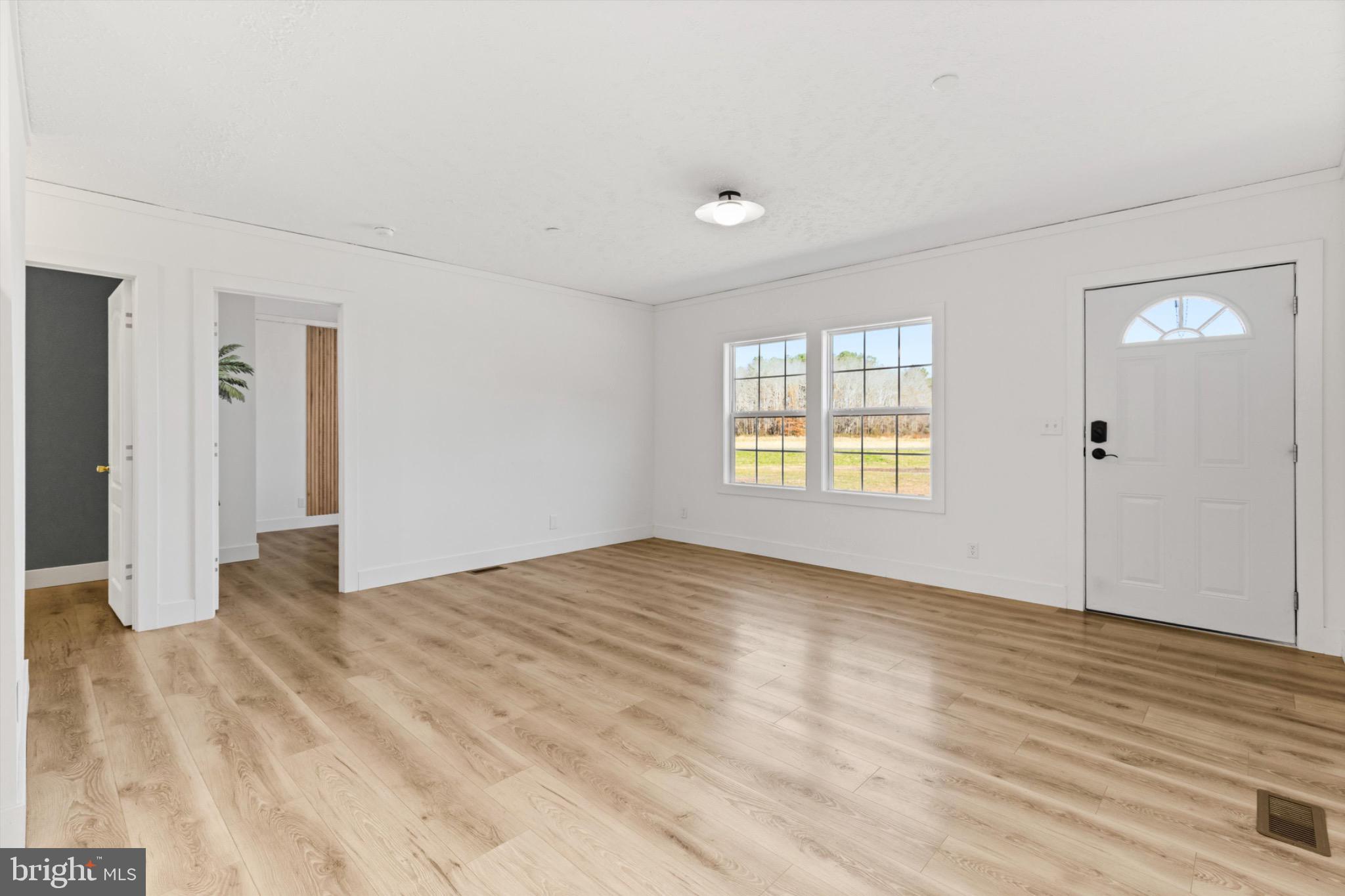 8937 Ninepin Branch Road Berlin, MD 21811 - Photo 6 of 44 Bright and airy living space awaits you.