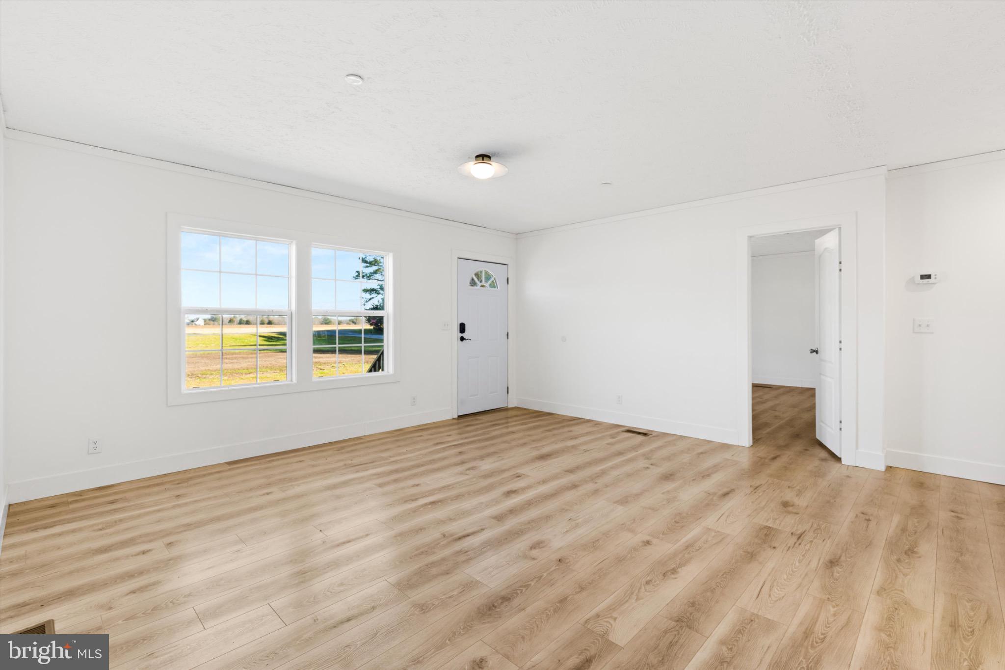 8937 Ninepin Branch Road Berlin, MD 21811 - Photo 7 of 44 Bright and airy living space with natural light.