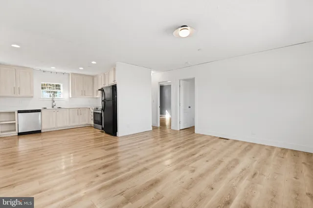 a view of a kitchen with a sink and a stove top oven