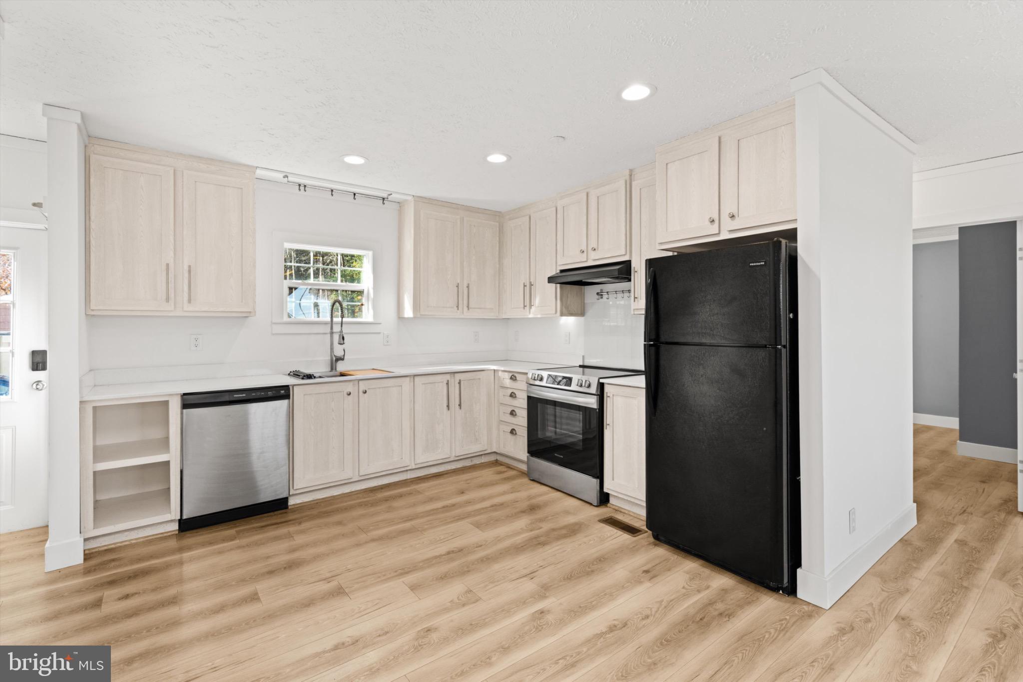 8937 Ninepin Branch Road Berlin, MD 21811 - Photo 9 of 44 Modern kitchen with sleek finishes.