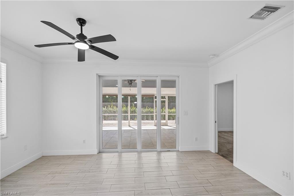 183 7th Street Naples, FL 34113 - Photo 15 of 50 a view of an empty room with a window