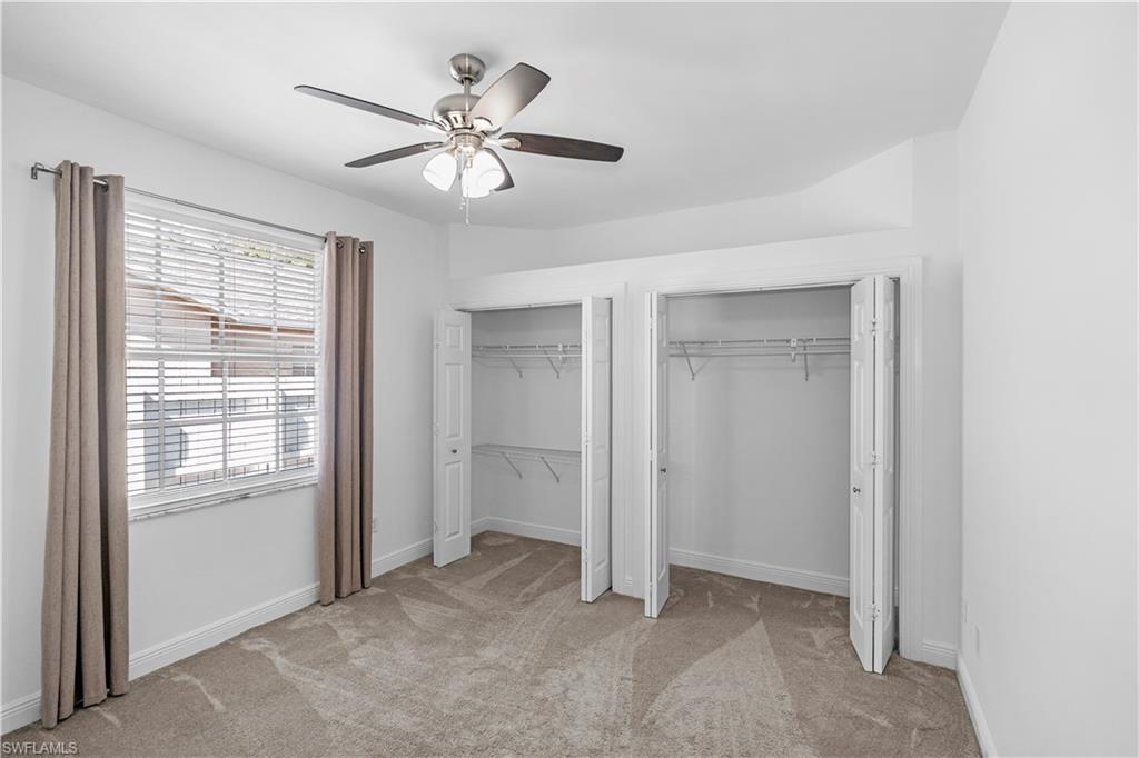 183 7th Street Naples, FL 34113 - Photo 19 of 50 a view of an empty room with a window
