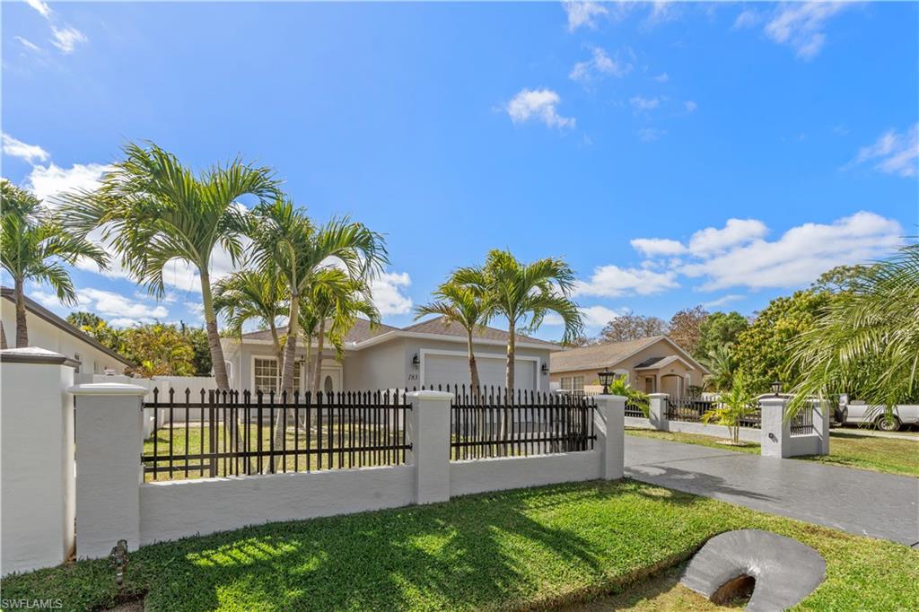 183 7th Street Naples, FL 34113 - Photo 2 of 50 a view of a backyard with a garden