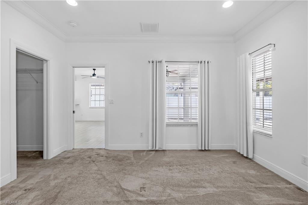 183 7th Street Naples, FL 34113 - Photo 27 of 50 an empty room with windows