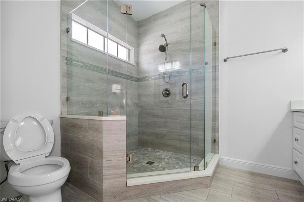 183 7th Street Naples, FL 34113 - Photo 32 of 50 a bathroom with a shower and toilet