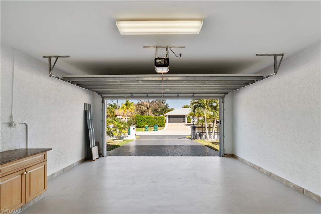 183 7th Street Naples, FL 34113 - Photo 46 of 50 a view of hallway with furniture and floor to ceiling window