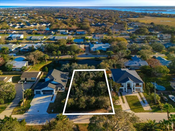 an aerial view of house with yard