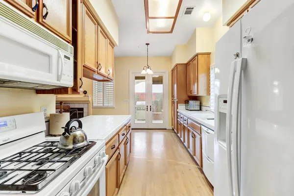 a view of a kitchen with a sink and cabinet area
