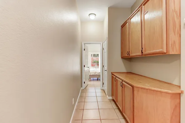 a bedroom with a bed and a television