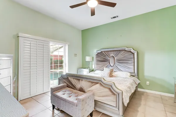 a bathroom with a bathtub sink and mirror