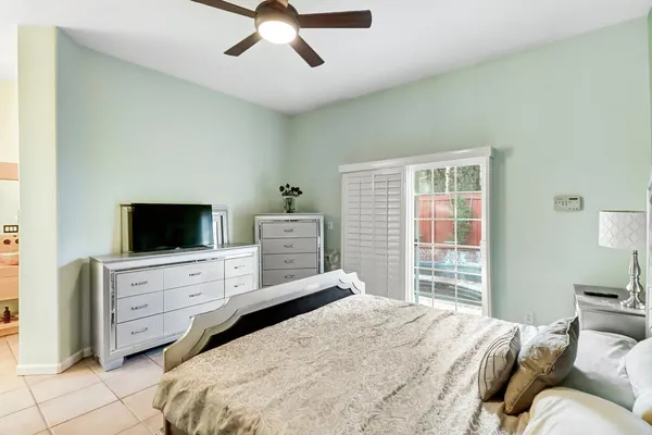 a view of walk in closet with clothes