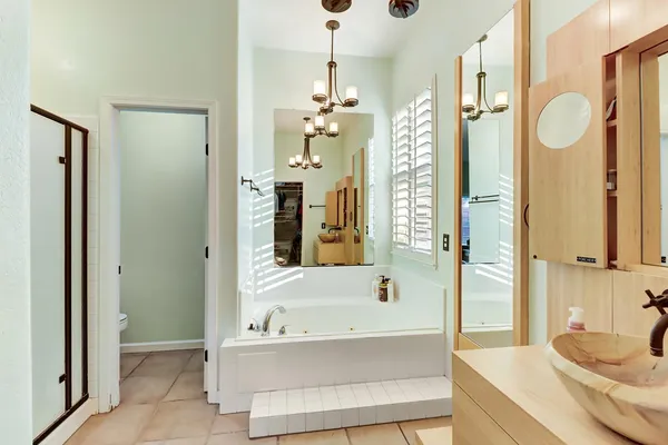 a bathroom with a glass door shower