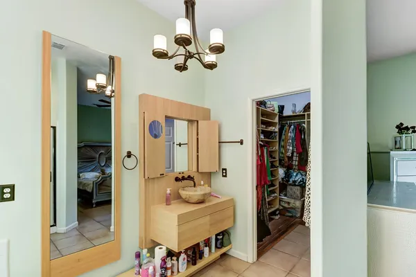 a bathroom with a double vanity sink and a mirror