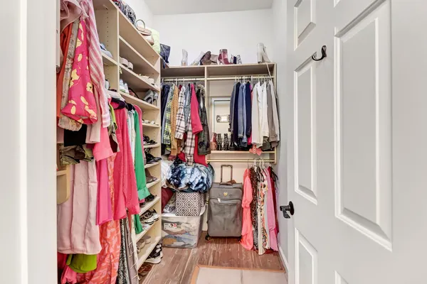 a bathroom with a sink vanity mirror and toilet