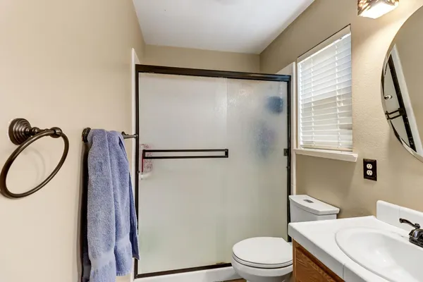 a view of a patio with table and chairs potted plants with wooden roof and fence