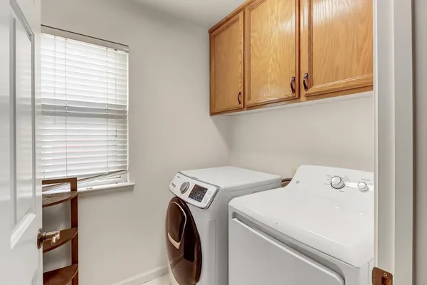 a view of a house with a backyard porch and sitting area