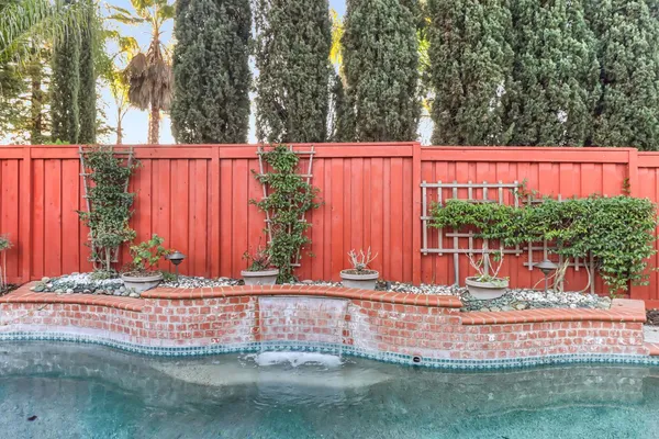 a view of a house with a flower garden