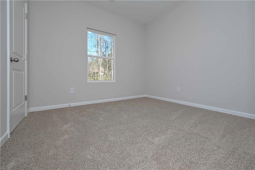 506 Charleston Place Villa Rica, GA 30180 - Photo 14 of 25 an empty room with a window