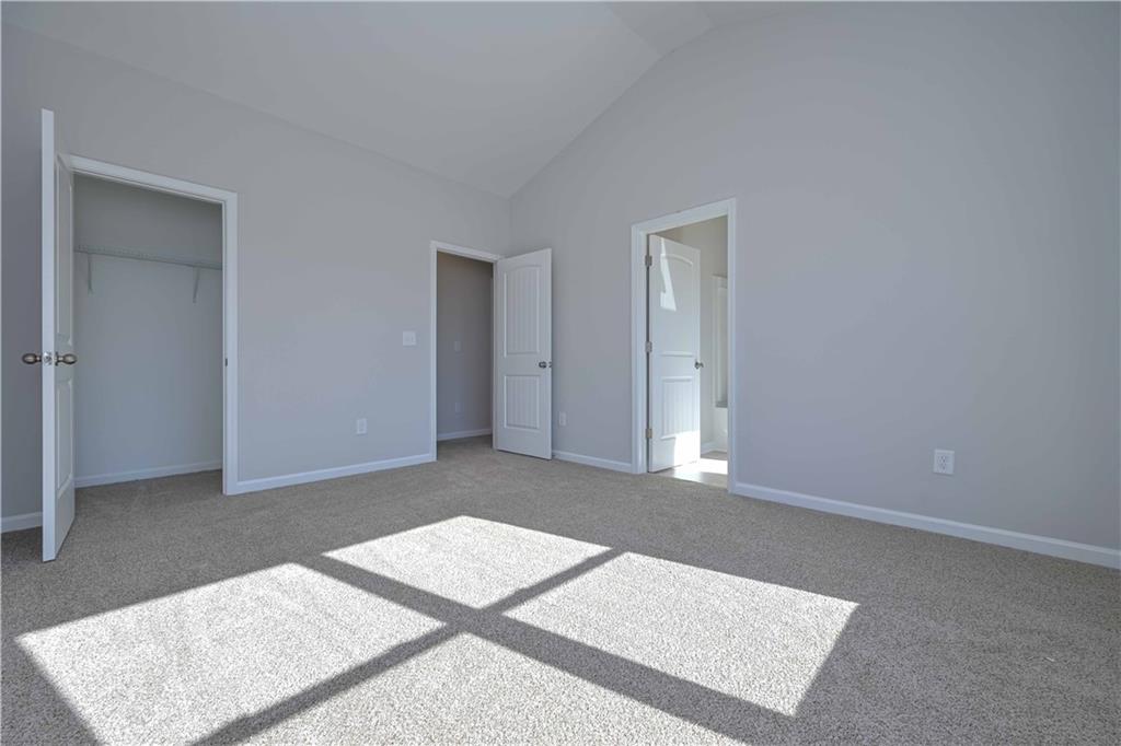 506 Charleston Place Villa Rica, GA 30180 - Photo 19 of 25 an empty room with windows