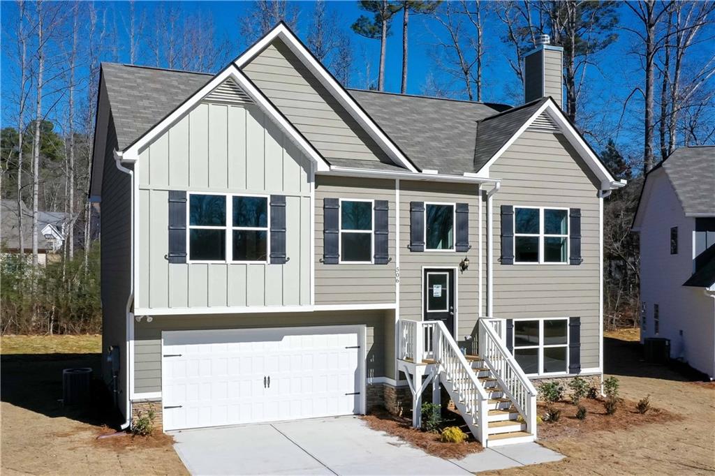 506 Charleston Place Villa Rica, GA 30180 - Photo 2 of 25 a front view of a house with a yard